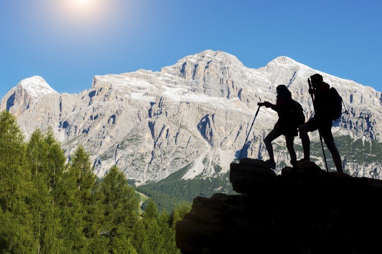 Two climbers looking at mountains